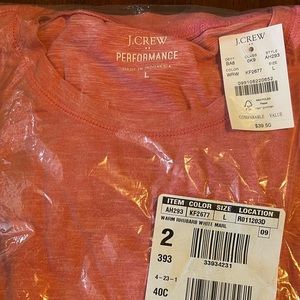 J Crew salmon colored performance t shirt with tags in plastic bag